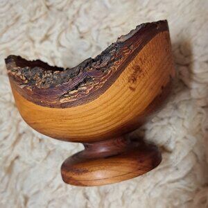 Wooden live edge footed bowl.